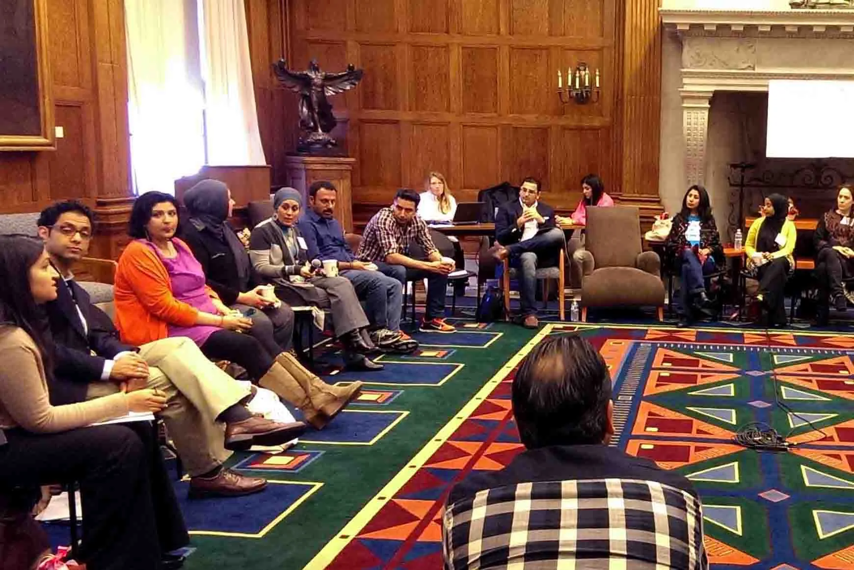 Workshop attendees sitting in a circle at Harvard University